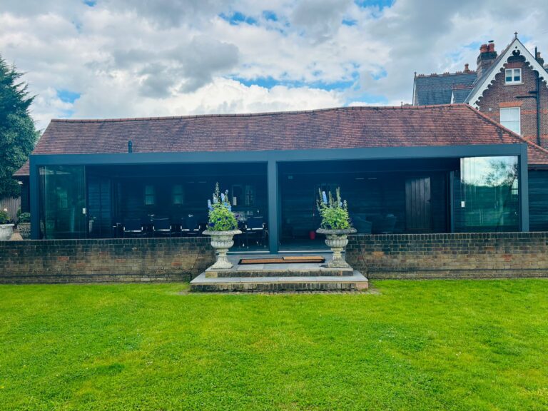 large bladed roof glazed pergola in anthracite