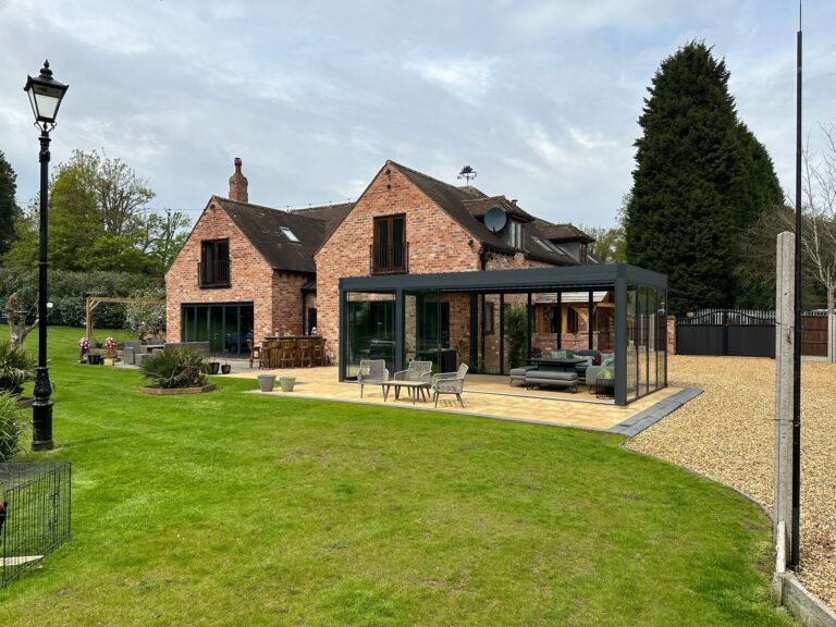 large pergola with bladed roof and glazing