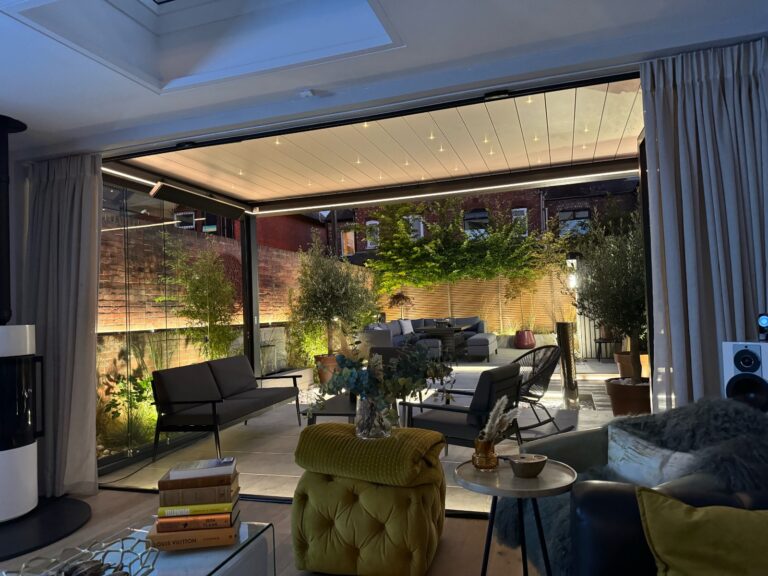 bladed roof pergola with lighting at night