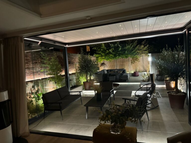bladed roof pergola with lighting at night