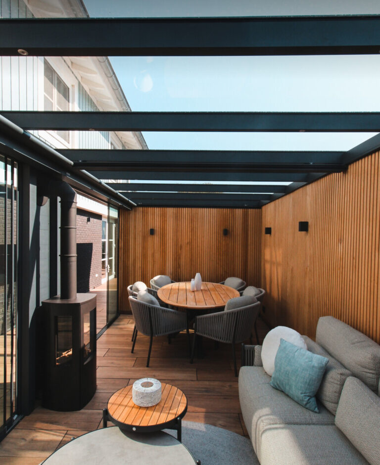 glass roof pergola with large log burner